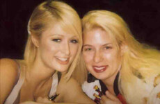 Two smiling individuals with blonde hair pose closely together for a photo against a dark background. Two smiling individuals with blonde hair pose closely together for a photo against a dark background.